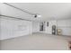 Spacious garage provides ample storage with white cabinets, and includes utility sink and garage door opener at 4729 Arrow Rd, Orlando, FL 32812