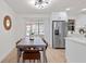 Bright, modern kitchen with a dining table and view of the backyard pool, offering a welcoming and functional space at 4729 Arrow Rd, Orlando, FL 32812