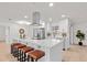 Stylish kitchen featuring a large island with seating, modern appliances, and ample cabinet space at 4729 Arrow Rd, Orlando, FL 32812