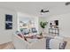 Bright and airy living room featuring a bay window and views of the landscaped front yard at 4729 Arrow Rd, Orlando, FL 32812
