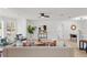 Bright living room featuring light wood floors, modern furnishings, and a cozy atmosphere at 4729 Arrow Rd, Orlando, FL 32812