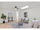 Cozy living room features a ceiling fan and skylight, with comfortable seating and stylish décor at 4729 Arrow Rd, Orlando, FL 32812