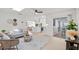 Open floor plan showcasing the light-filled living room that leads into the modern kitchen at 4729 Arrow Rd, Orlando, FL 32812