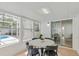 Bright sunroom overlooking the pool; features dining table, chairs, and lots of natural light at 4729 Arrow Rd, Orlando, FL 32812
