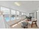 Bright sunroom with lots of windows overlooking the pool; includes seating and dining areas at 4729 Arrow Rd, Orlando, FL 32812