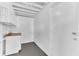 White unfinished basement featuring shelving and utility access at 5201 Van Aken Dr, Orlando, FL 32808
