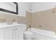 Bathroom with a white vanity, bathtub and shower combination with tile surround at 5201 Van Aken Dr, Orlando, FL 32808