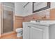Bathroom featuring a white vanity with a shower at 5201 Van Aken Dr, Orlando, FL 32808