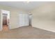 Neutral bedroom featuring tile floors and a connecting bathroom and walk-in closet at 5201 Van Aken Dr, Orlando, FL 32808