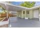 Attached carport providing covered parking and direct access to the home at 5201 Van Aken Dr, Orlando, FL 32808