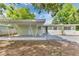 Charming single-story home with a covered entryway, creating a welcoming curb appeal at 5201 Van Aken Dr, Orlando, FL 32808