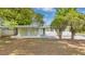 Charming single-story home with a covered entryway, creating a welcoming curb appeal at 5201 Van Aken Dr, Orlando, FL 32808
