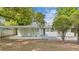 Charming single-story home featuring a covered carport and quaint front yard landscaping at 5201 Van Aken Dr, Orlando, FL 32808