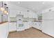 Modern kitchen featuring white cabinets, sleek countertops, and stainless steel appliances at 5201 Van Aken Dr, Orlando, FL 32808