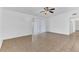 Light-filled living room with tile floors, ceiling fan, and a large sliding glass door at 5201 Van Aken Dr, Orlando, FL 32808