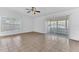 Spacious living room with tile flooring, ceiling fan and sliding glass door for plenty of natural light at 5201 Van Aken Dr, Orlando, FL 32808
