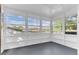 Enclosed patio with paneled walls, many windows, and views of the outdoors at 5201 Van Aken Dr, Orlando, FL 32808