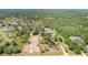 Expansive property featuring a home with a pond and lots of surrounding trees and greenery at 5242 Bancroft Blvd, Orlando, FL 32833