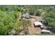 Wide aerial view showcasing the property's layout, including the house, barn, and surrounding landscape at 5242 Bancroft Blvd, Orlando, FL 32833