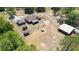Aerial view of the property highlighting the house, outbuildings, and fenced yard at 5242 Bancroft Blvd, Orlando, FL 32833
