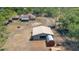 Aerial view showcasing the home, large storage building, and fenced area at 5242 Bancroft Blvd, Orlando, FL 32833