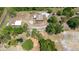Expansive aerial view of a home featuring a large lot, mature trees, and a pond enhancing the property's appeal at 5242 Bancroft Blvd, Orlando, FL 32833