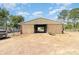 Large barn featuring multiple horse stalls and a driveway to back of property at 5242 Bancroft Blvd, Orlando, FL 32833