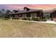 Attractive single-story home featuring manicured hedges and a connecting carport at 5242 Bancroft Blvd, Orlando, FL 32833