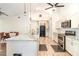Open kitchen with granite countertops, stainless steel appliances, and adjacent dining area at 5242 Bancroft Blvd, Orlando, FL 32833
