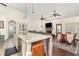 Open-concept kitchen and dining area with granite countertops and modern finishes at 5242 Bancroft Blvd, Orlando, FL 32833