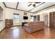 Comfortable living room with hardwood floors, a TV, and natural light from large windows at 5242 Bancroft Blvd, Orlando, FL 32833