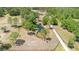 A tranquil pond is surrounded by trees, creating a serene focal point for the property at 5242 Bancroft Blvd, Orlando, FL 32833