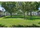 A large, well-manicured lawn with mature trees provides a peaceful and inviting outdoor setting at 5258 Tunbridge Wells Ln # 4, Orlando, FL 32812