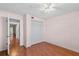 This bedroom offers warm hardwood floors and a large closet for plenty of storage at 5258 Tunbridge Wells Ln # 4, Orlando, FL 32812