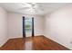 Bright bedroom with wood floors, a ceiling fan, and a window with nice views at 5258 Tunbridge Wells Ln # 4, Orlando, FL 32812