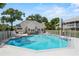 A community pool and clubhouse offer a place to relax and socialize at Coach Homes at 5258 Tunbridge Wells Ln # 4, Orlando, FL 32812