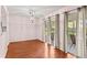 Bright dining area featuring wood floors and sliding glass doors to the porch at 5258 Tunbridge Wells Ln # 4, Orlando, FL 32812