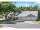 A well-maintained townhome with mature trees, enhancing its curb appeal and providing shade at 5258 Tunbridge Wells Ln # 4, Orlando, FL 32812