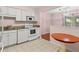 Cozy kitchen featuring white appliances, granite countertops and tile flooring at 5258 Tunbridge Wells Ln # 4, Orlando, FL 32812
