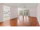 Open-concept living space with hardwood floors and access to the kitchen, creating an inviting atmosphere at 5258 Tunbridge Wells Ln # 4, Orlando, FL 32812