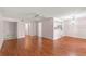 Bright and airy living space with hardwood floors that connects seamlessly to the kitchen area at 5258 Tunbridge Wells Ln # 4, Orlando, FL 32812