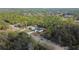 The home's position among lush trees can be seen from this elevated perspective showing the neighboring area at 54 Malauka Trak, Ocklawaha, FL 32179