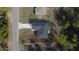 Aerial view showing the roof of the house and the surrounding lot with adjacent houses at 54 Malauka Trak, Ocklawaha, FL 32179