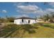 The property has an expansive backyard and features a sliding glass door that leads to the patio at 54 Malauka Trak, Ocklawaha, FL 32179