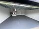 Spacious two-car garage featuring painted walls and sealed floor at 54 Malauka Trak, Ocklawaha, FL 32179