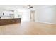 Bright and airy living room with modern flooring, recessed lighting, and open layout into the kitchen at 54 Malauka Trak, Ocklawaha, FL 32179