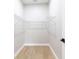Functional walk-in closet with shelving, ready for organization, and bright neutral walls at 54 Malauka Trak, Ocklawaha, FL 32179