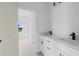 Bathroom featuring double vanity with quartz countertops and sleek black hardware at 55 Laurel Crse, Ocala, FL 34480