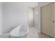 Modern bathroom featuring a freestanding tub, tiled shower, and neutral color palette at 55 Laurel Crse, Ocala, FL 34480