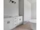 Bathroom with double vanities and a freestanding tub, boasting ample space and modern design at 55 Laurel Crse, Ocala, FL 34480